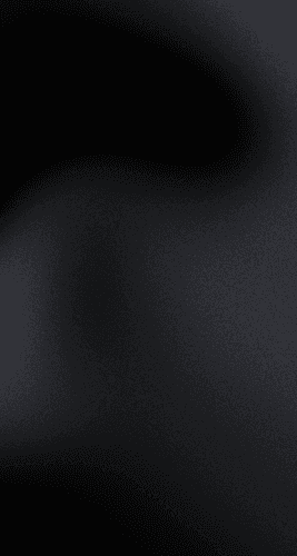 A gradient image transitioning from dark black to light gray tones.